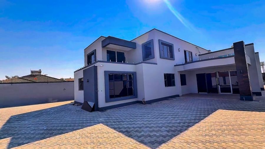 Front elevation and paved forecourt