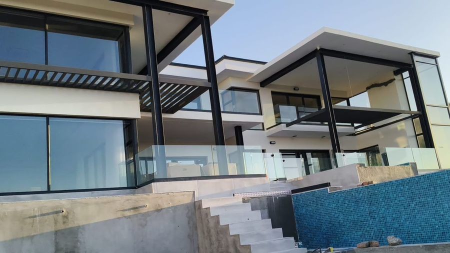 Steel-framed terraces above the pool