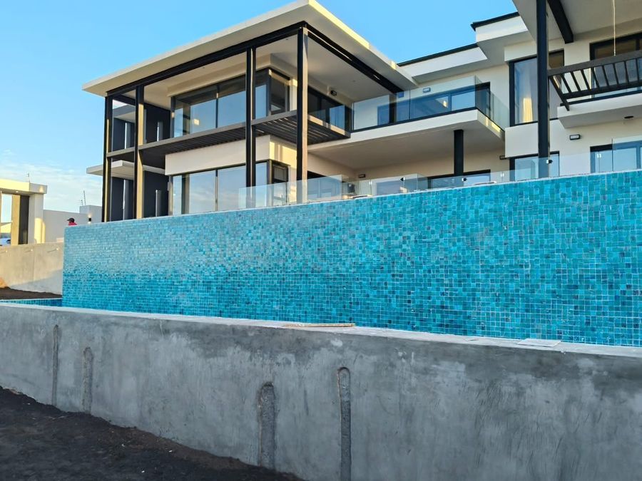 Mosaic-tiled infinity pool edge